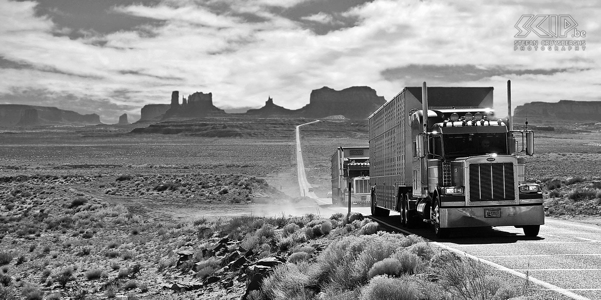 Monument Valley - Trucks Big American trucks on highway 163 with the silhouette of Monument Valley in the background. Stefan Cruysberghs